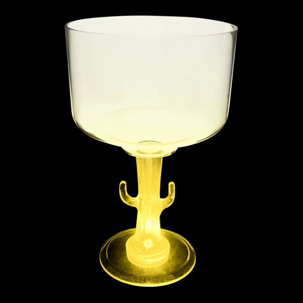 A clear plastic margarita cup with a cactus shaped stem and a yellow LED light.