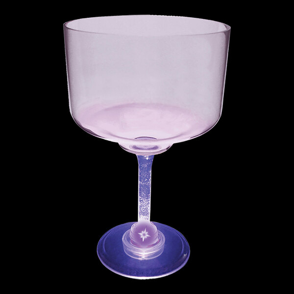 A clear plastic margarita cup with a purple base.