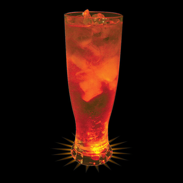 A customizable plastic Pilsner cup filled with orange liquid and ice with a red LED light inside.