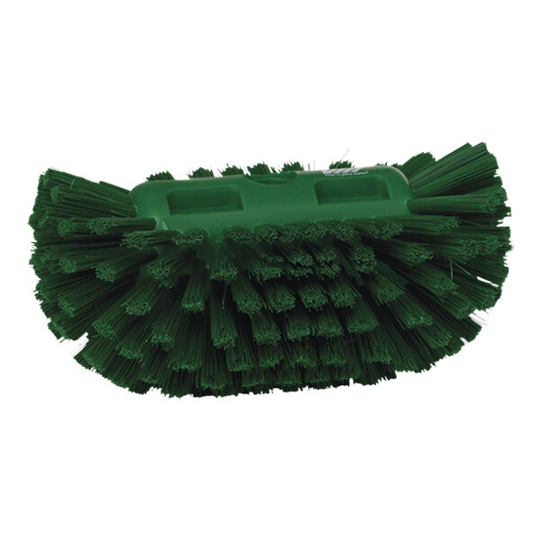 A green brush head with medium stiff bristles.
