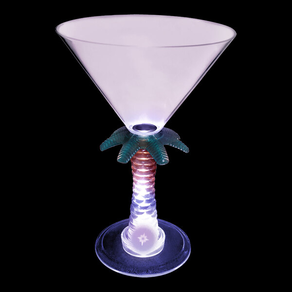 A clear plastic martini glass with a palm tree stem and a purple LED light.
