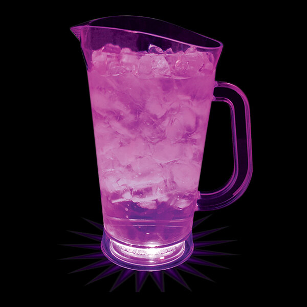 A customizable plastic pitcher with a pink drink and ice on a bar counter.