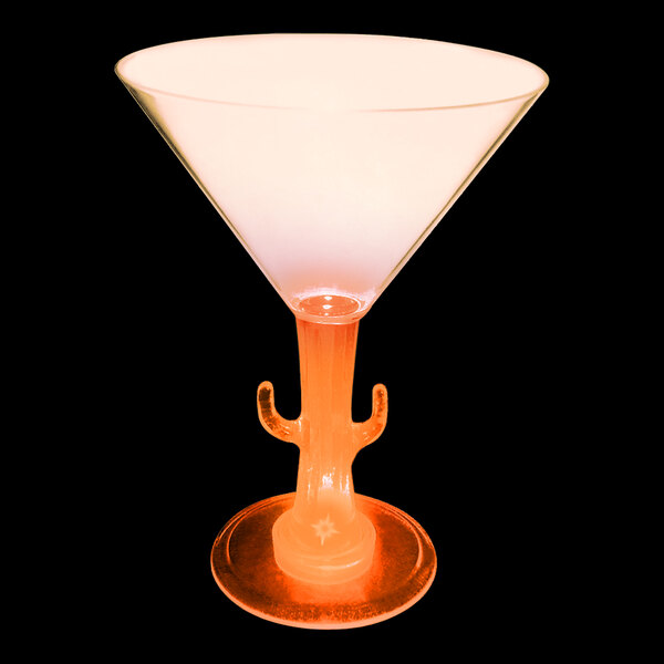 A customizable plastic cactus stem martini cup with an orange LED light and a drink in it.