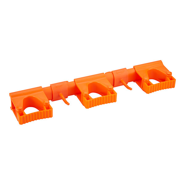 An orange plastic Vikan wall bracket with two hooks.