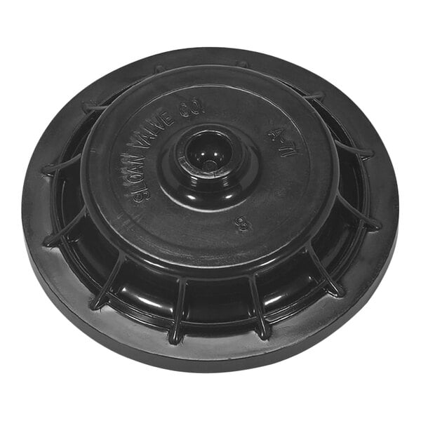A black plastic round object with a hole in the center.