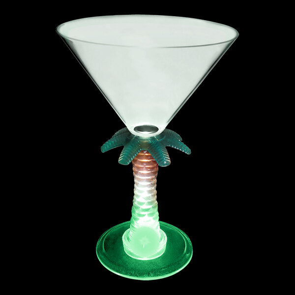 A clear plastic martini glass with a palm tree stem and a green LED light.