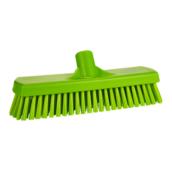A green Vikan wall/floor scrub brush head with stiff bristles.
