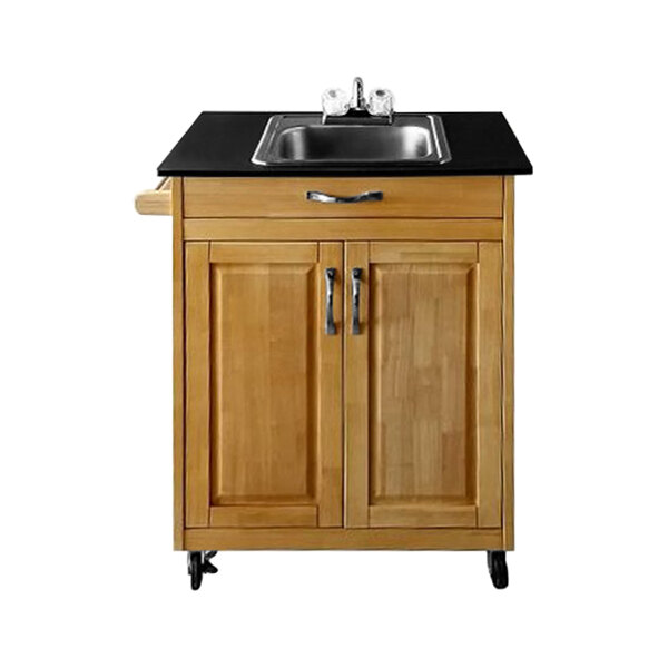 A Monsam portable sink with a wood cabinet.