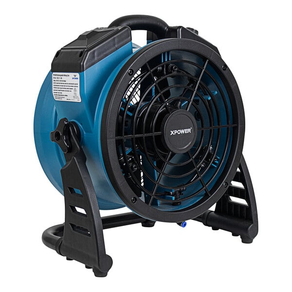An XPOWER blue and black battery-powered misting fan on a stand.