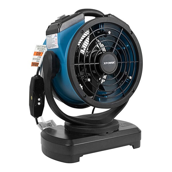 An XPOWER blue and black portable air circulator and misting fan on a stand.