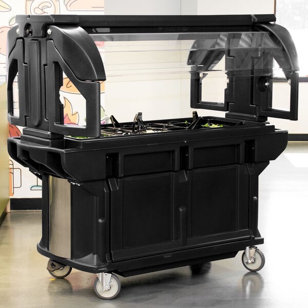 A black food cart with a clear top.
