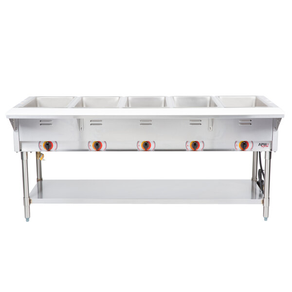 A stainless steel APW Wyott stationary steam table with five sealed wells on a counter.