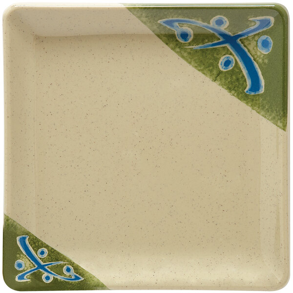 A white square melamine plate with a green and blue Japanese design.