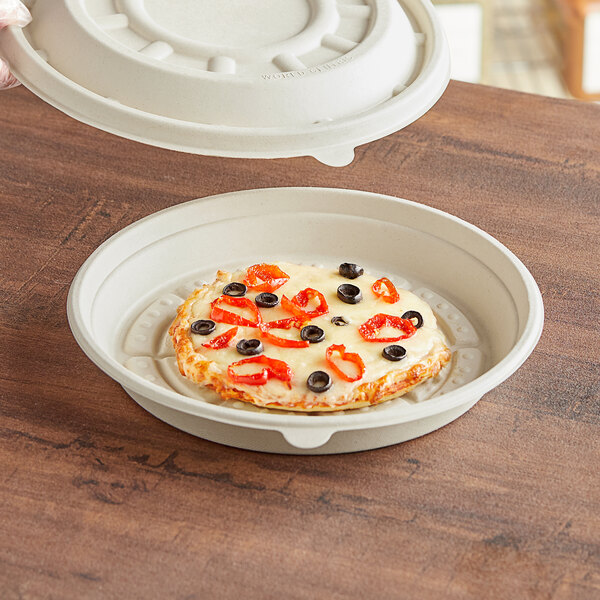 A World Centric compostable fiber pizza container holding a pizza.