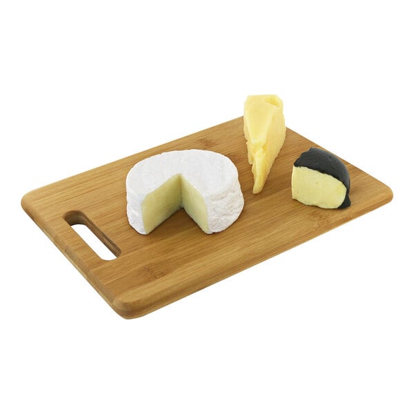 A Franmara bamboo cutting board with cheese and a knife on it.