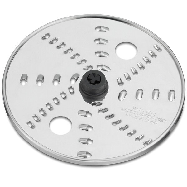 A circular metal Waring grating and shredding disc with holes.