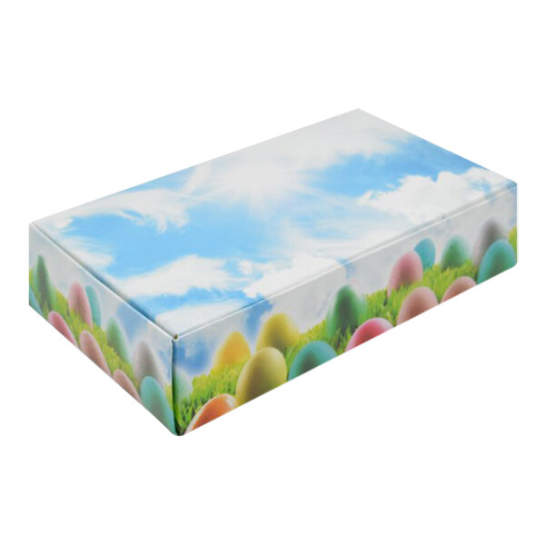 A white Easter candy box with colorful eggs on it.