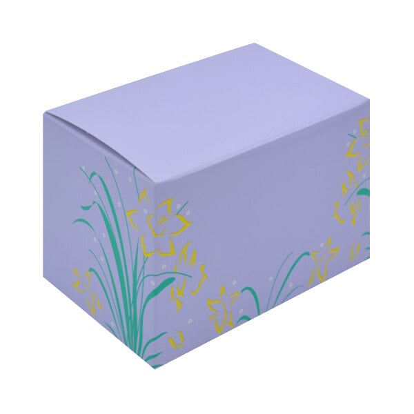 A white 1/2 lb. Lilac Easter egg candy box with yellow flowers on it.