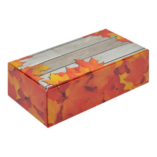 An Autumn candy box with a maple leaf pattern on it.