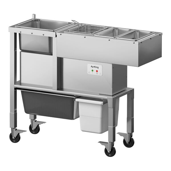 An AyrKing stainless steel breading station with two trays on wheels.