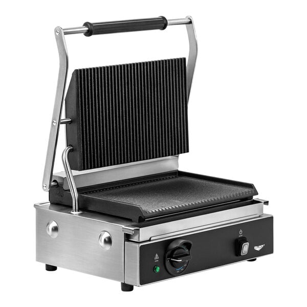 A black and silver Vollrath panini grill on a counter.