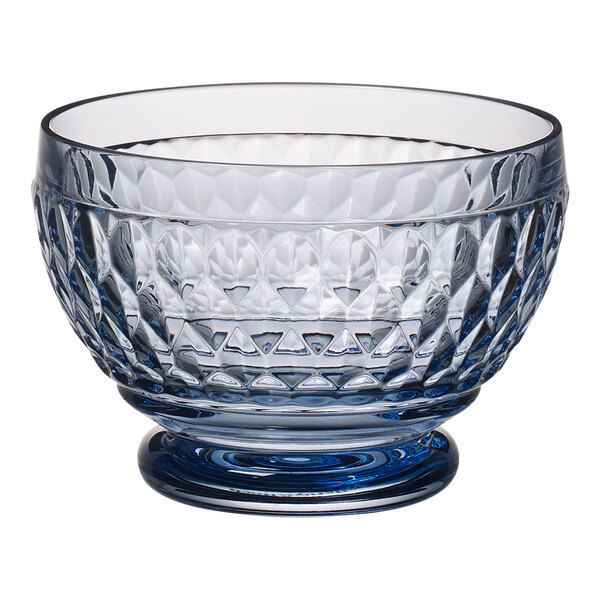 A clear glass bowl with a blue diamond pattern on the base.