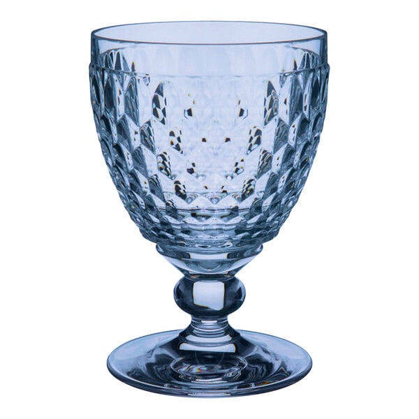 A close up of a clear Villeroy & Boch wine glass with a diamond pattern.