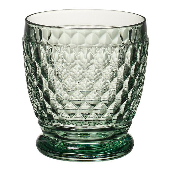 A close up of a Villeroy & Boch green glass tumbler with a diamond pattern.
