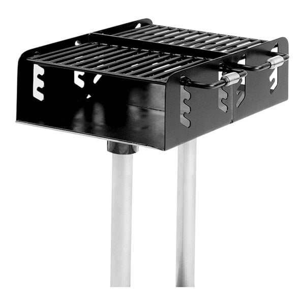 An Ultra Site inground mount grill with two metal grates over the top.