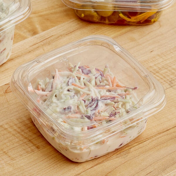 A Pactiv plastic deli lid on a plastic container of food.
