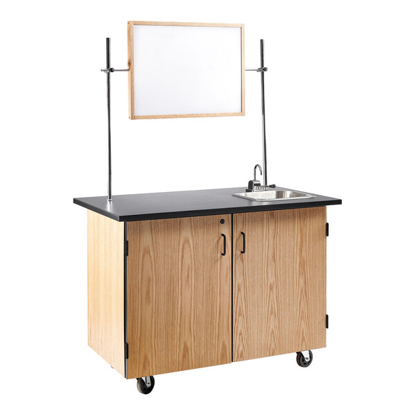 A white National Public Seating mobile science cart with a sink, mirror, and whiteboard.