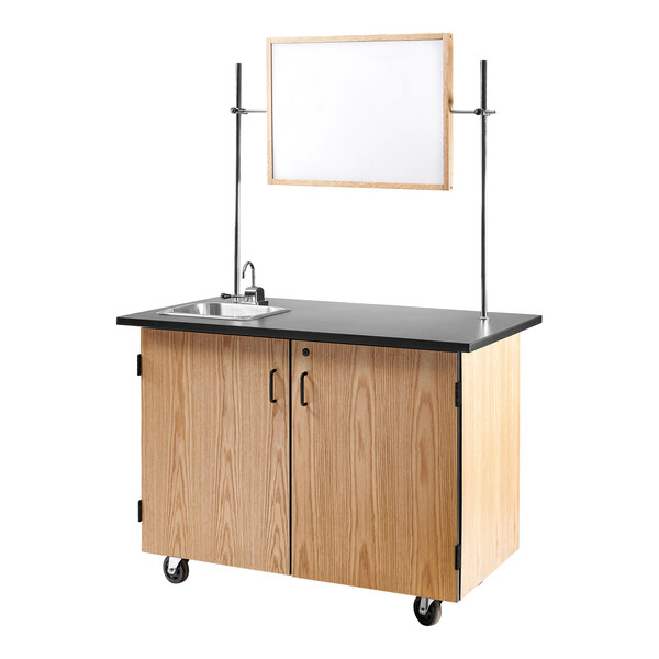 A white National Public Seating science cart with a sink, mirror, and whiteboard.