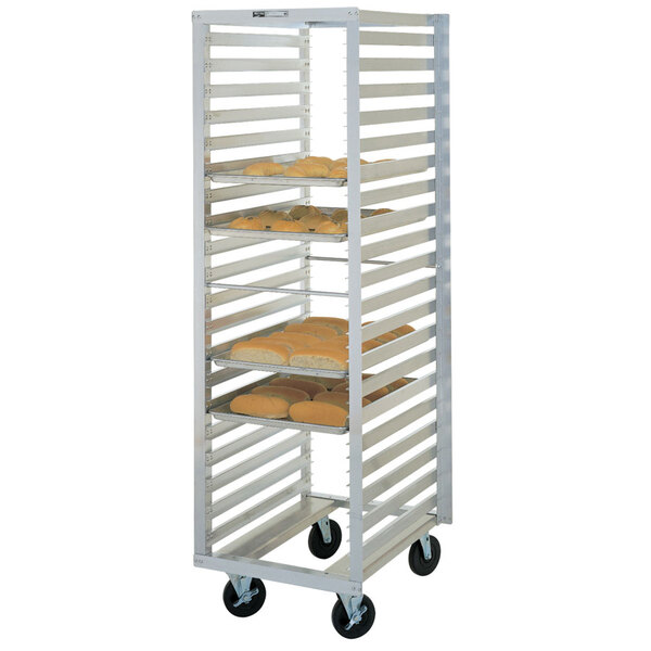 A Metro aluminum sheet pan rack with trays in it.