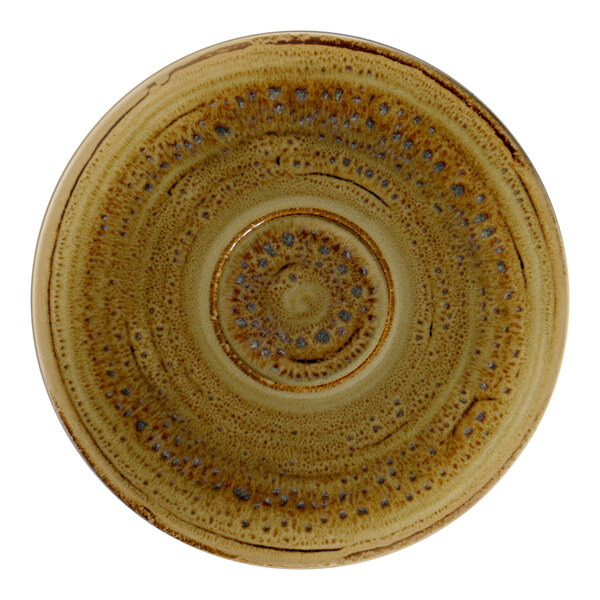 A brown porcelain saucer with a spiral design in white.