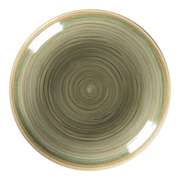 A close up of a RAK Porcelain deep coupe plate with a green and brown spiral design.