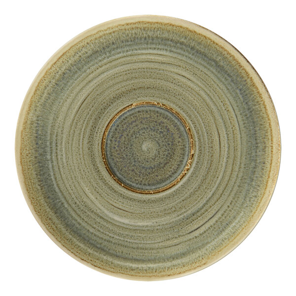 A close up of a RAK Porcelain emerald green saucer with a circular design.