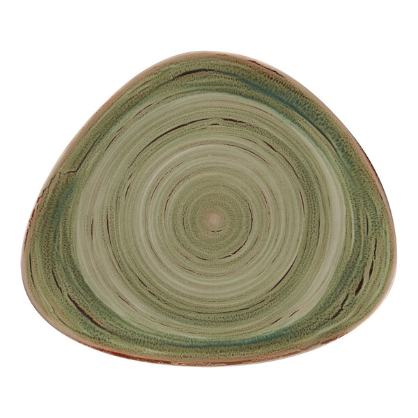 A close up of a RAK Porcelain green plate with a spiral pattern.