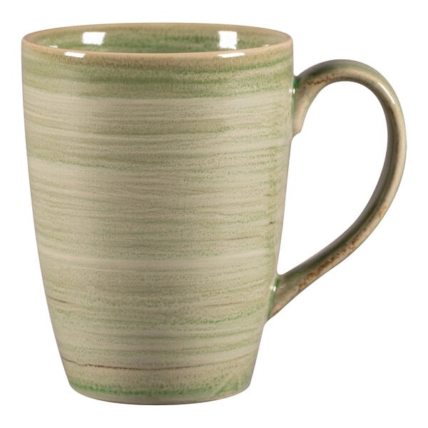 A white porcelain mug with a green and white striped pattern and a handle.
