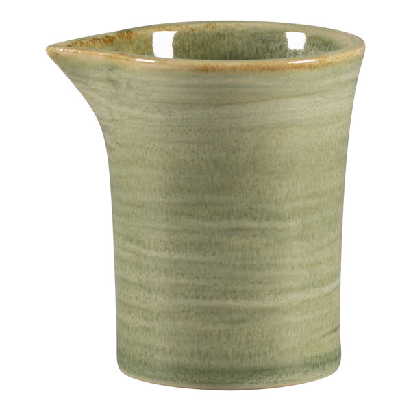 A green RAK Porcelain ceramic creamer with a handle.