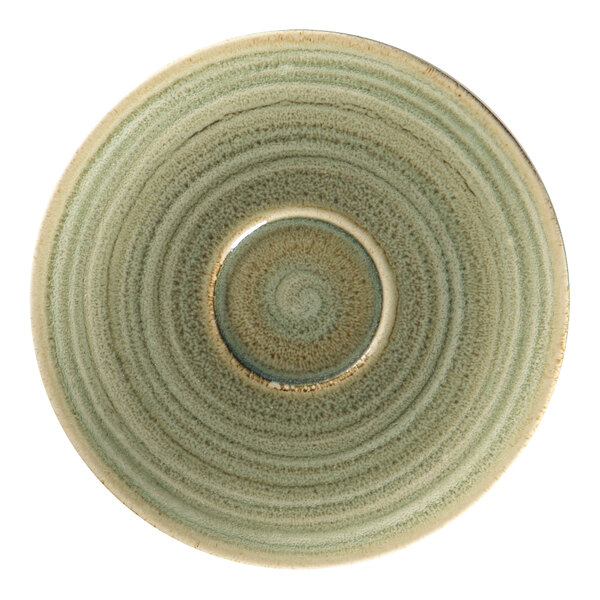 A close-up of a RAK Porcelain emerald green saucer with a circular design.