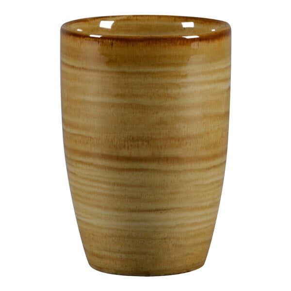 A close up of a brown RAK Porcelain mug with a handle.
