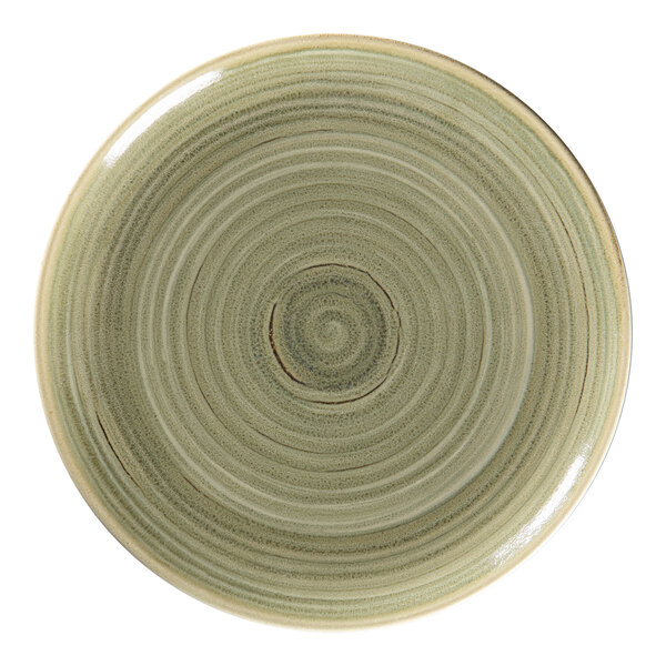 A close up of a RAK Porcelain Emerald green flat coupe plate with a spiral design.