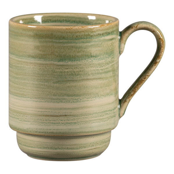 A green and white porcelain mug with a handle.