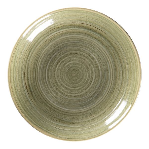 A close-up of a RAK Porcelain deep coupe plate with a green circular spiral pattern.