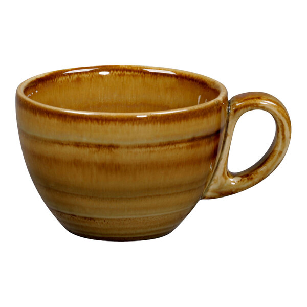 A brown coffee cup with a handle.