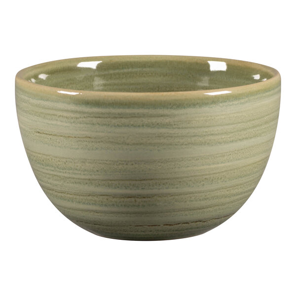 A green porcelain cup with a white rim.