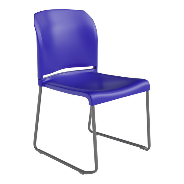 A blue Flash Furniture Hercules stacking chair with a gray metal sled base.