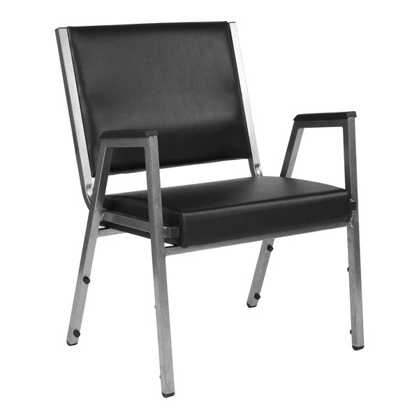 A Flash Furniture black vinyl and chrome steel bariatric reception arm chair.
