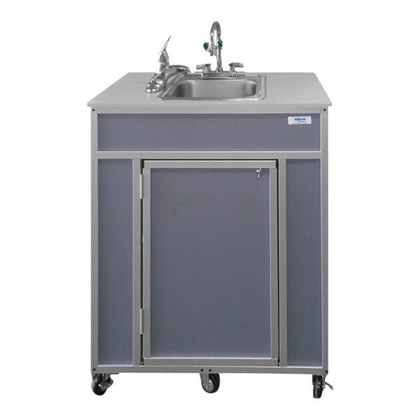 A Monsam gray portable eye and face washing station on wheels.