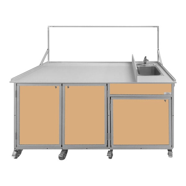A Monsam maple food service cart with a portable sink, two drawers, and a cabinet.